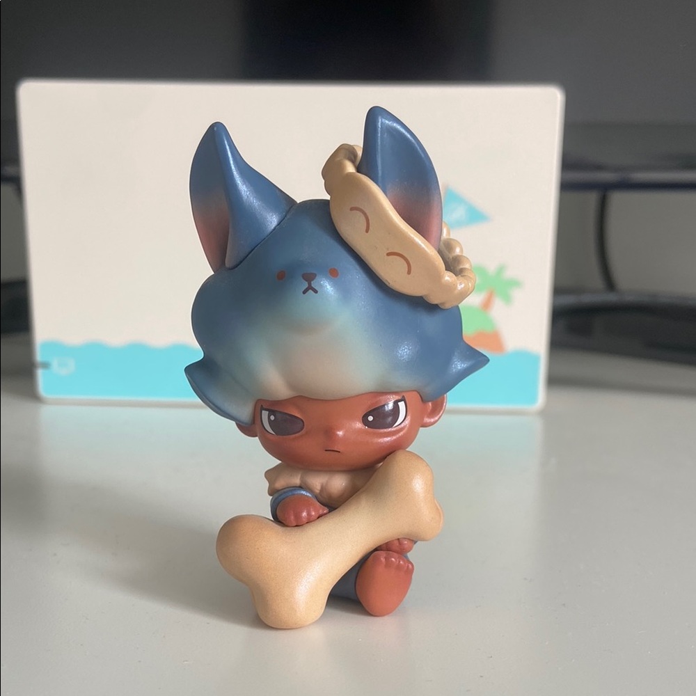Blue and Brown Dimoo Figure with Bone Accessory (POP MART)